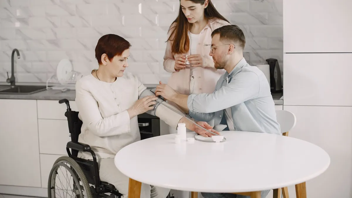Home healthcare worker assisting an elderly patient